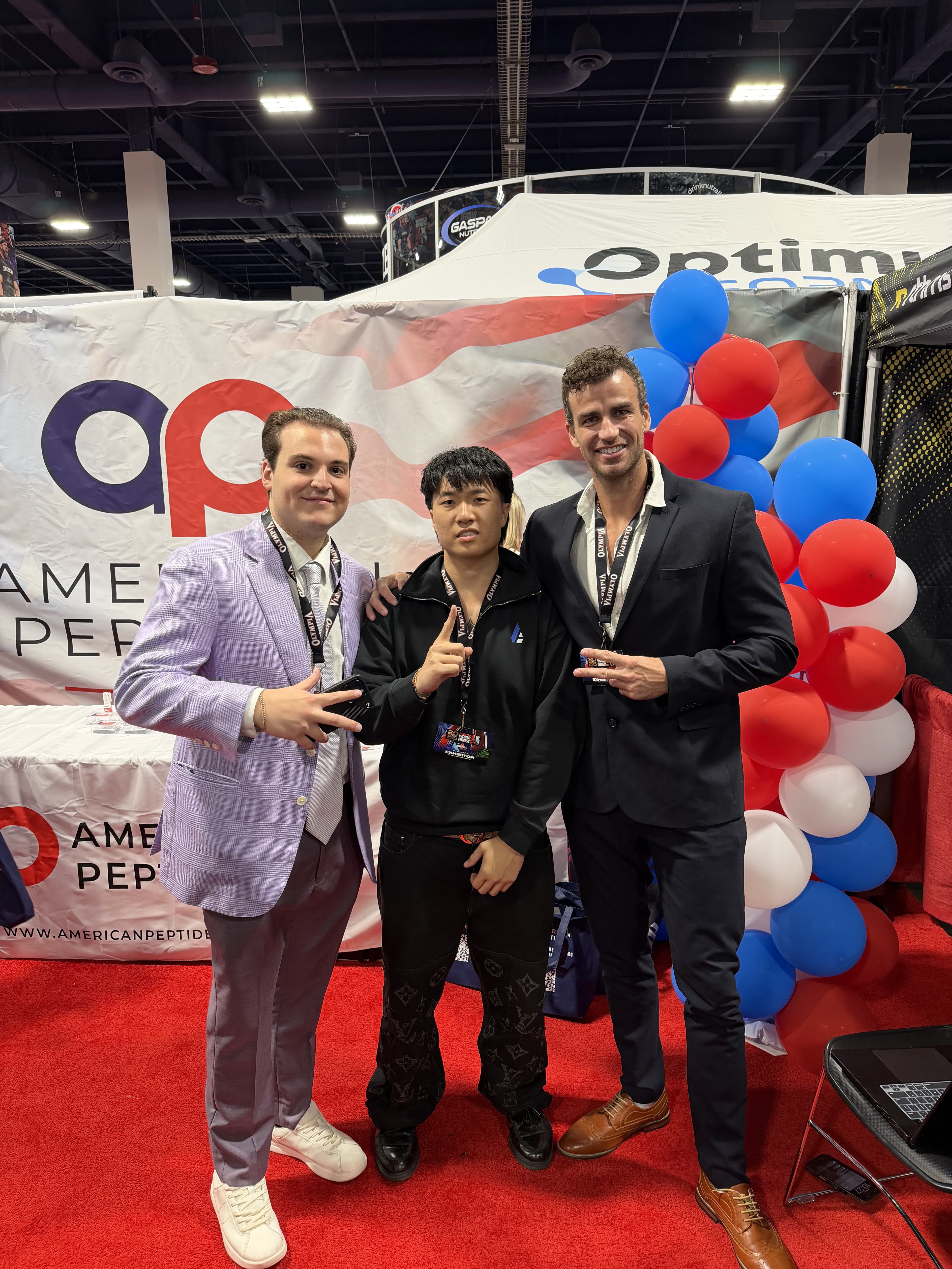 Group photo at a peptide industry expo